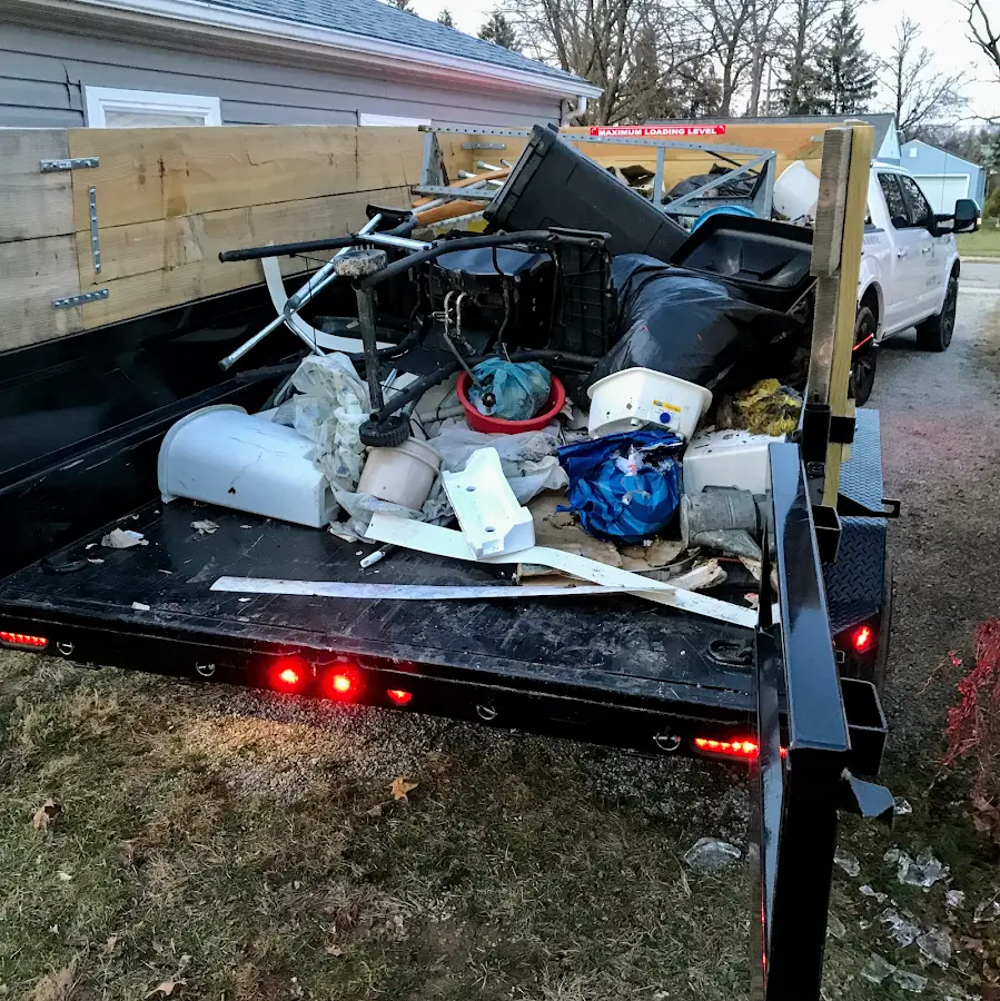 Roll-off dumpster delivered to a residential driveway in June Park